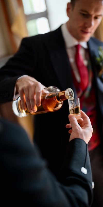 Whisky pouring into a glass, close-up