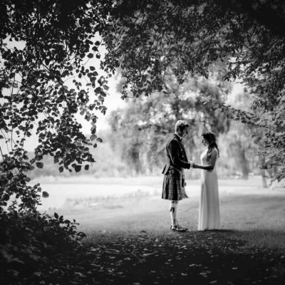 Couple holding hands looking down