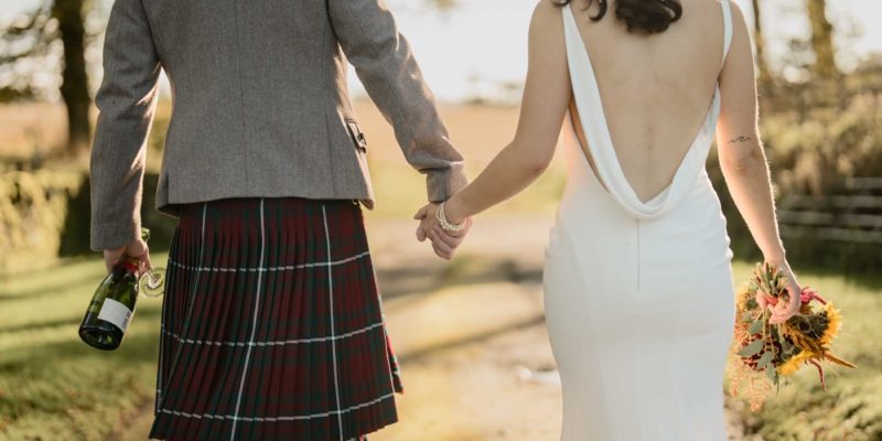 Close-up of couple holding hands