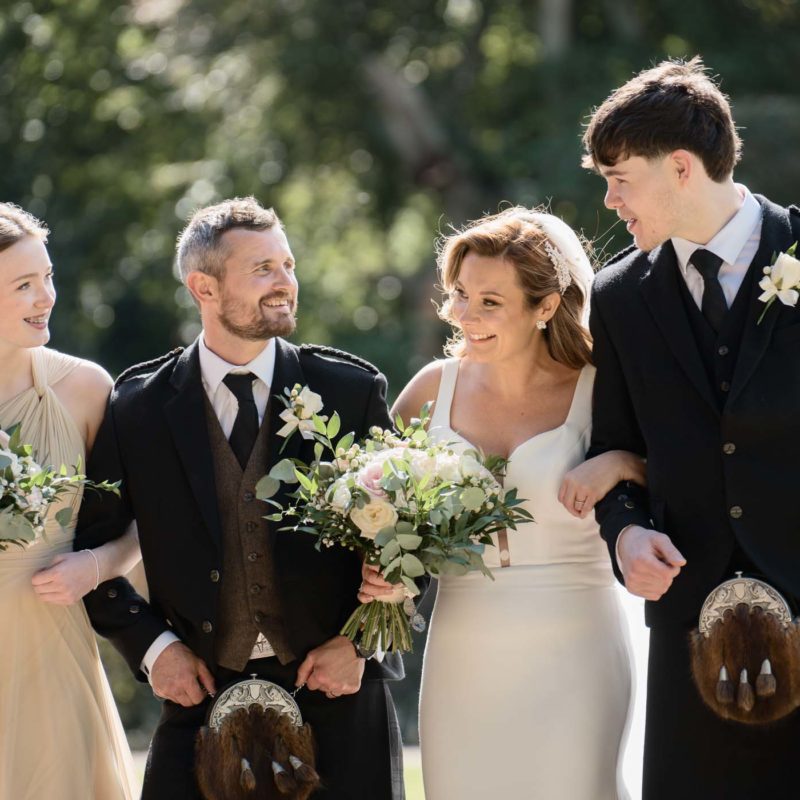 Natural wedding family photo outdoors