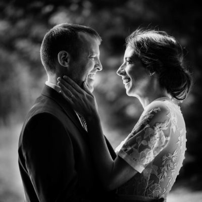 Backlit photo of bride and groom in black and white