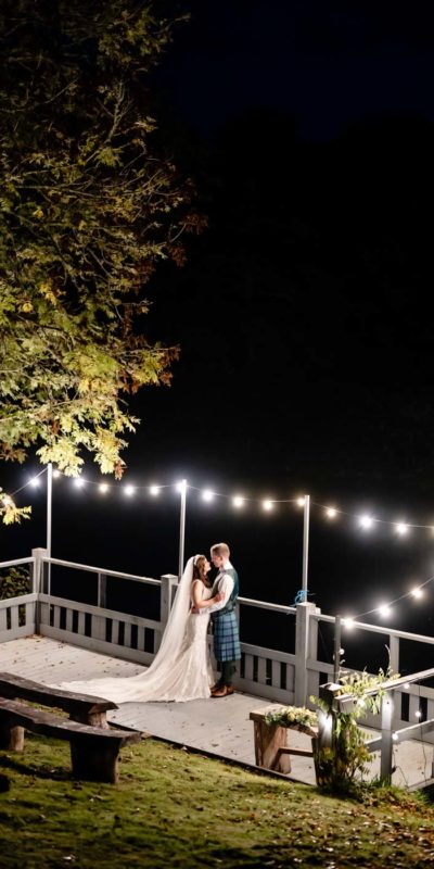 Festoon lighting with couple kissing