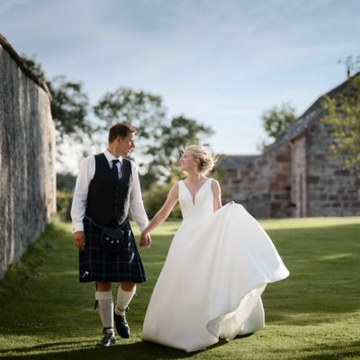 Newlyweds in warm evening summer light