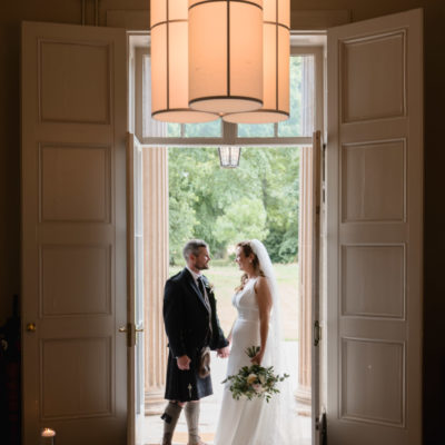 Elegant bride and groom in doorway