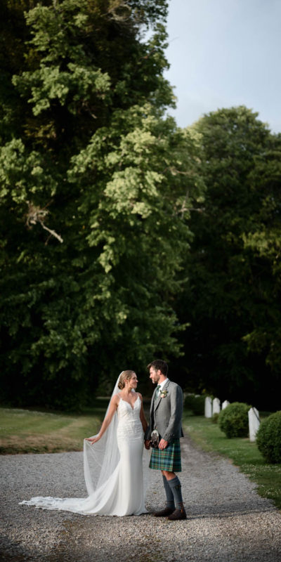 Couple sharing a moment with trees behind them