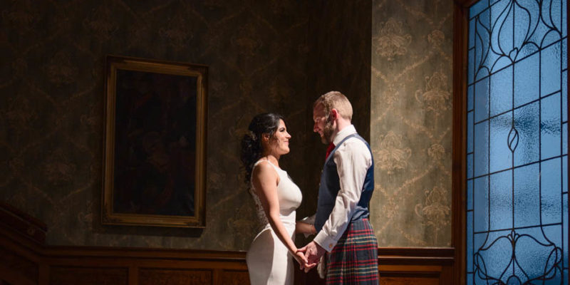 Bride and groom on stairs at night