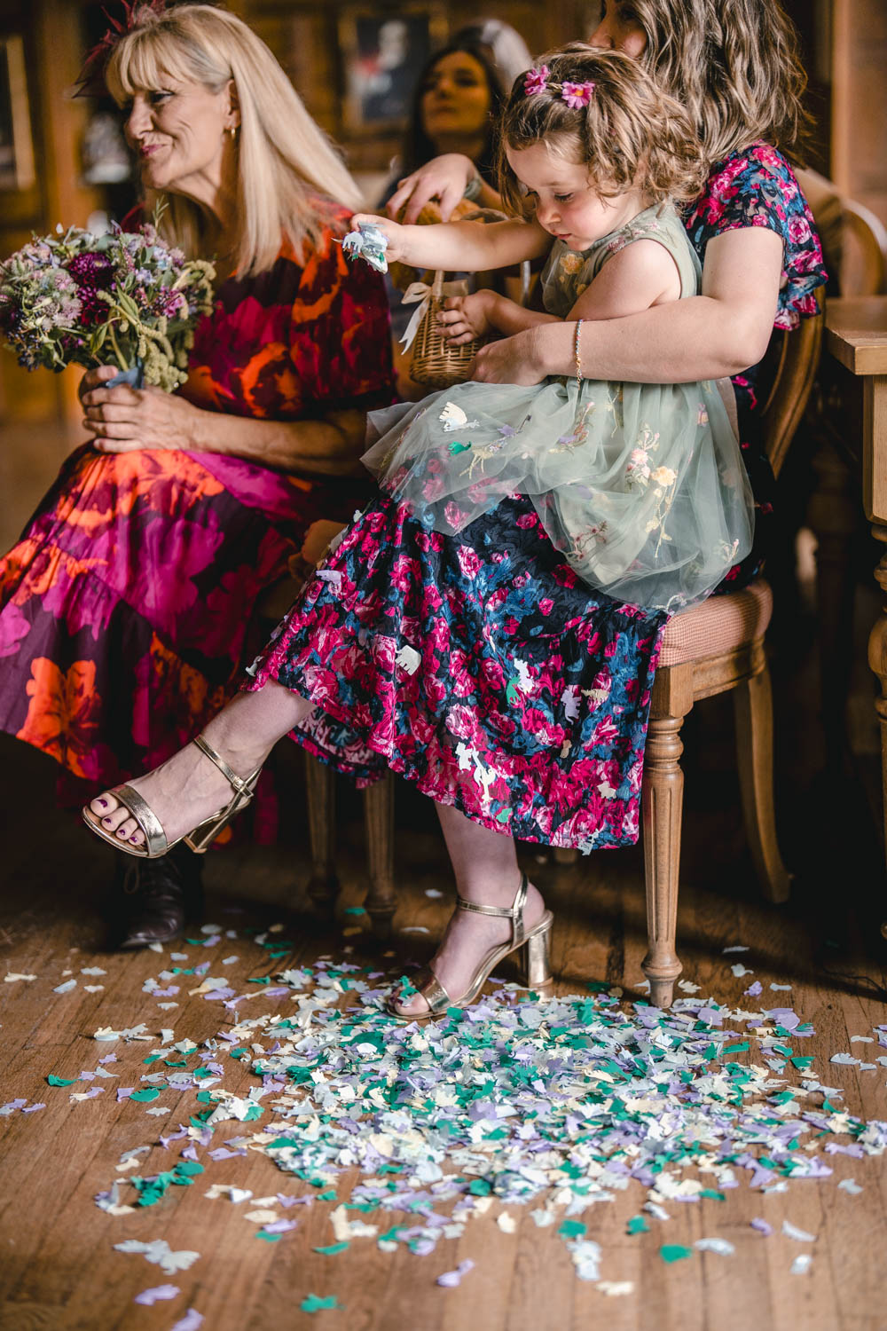 Flower girl scattering petals at a wedding ceremony