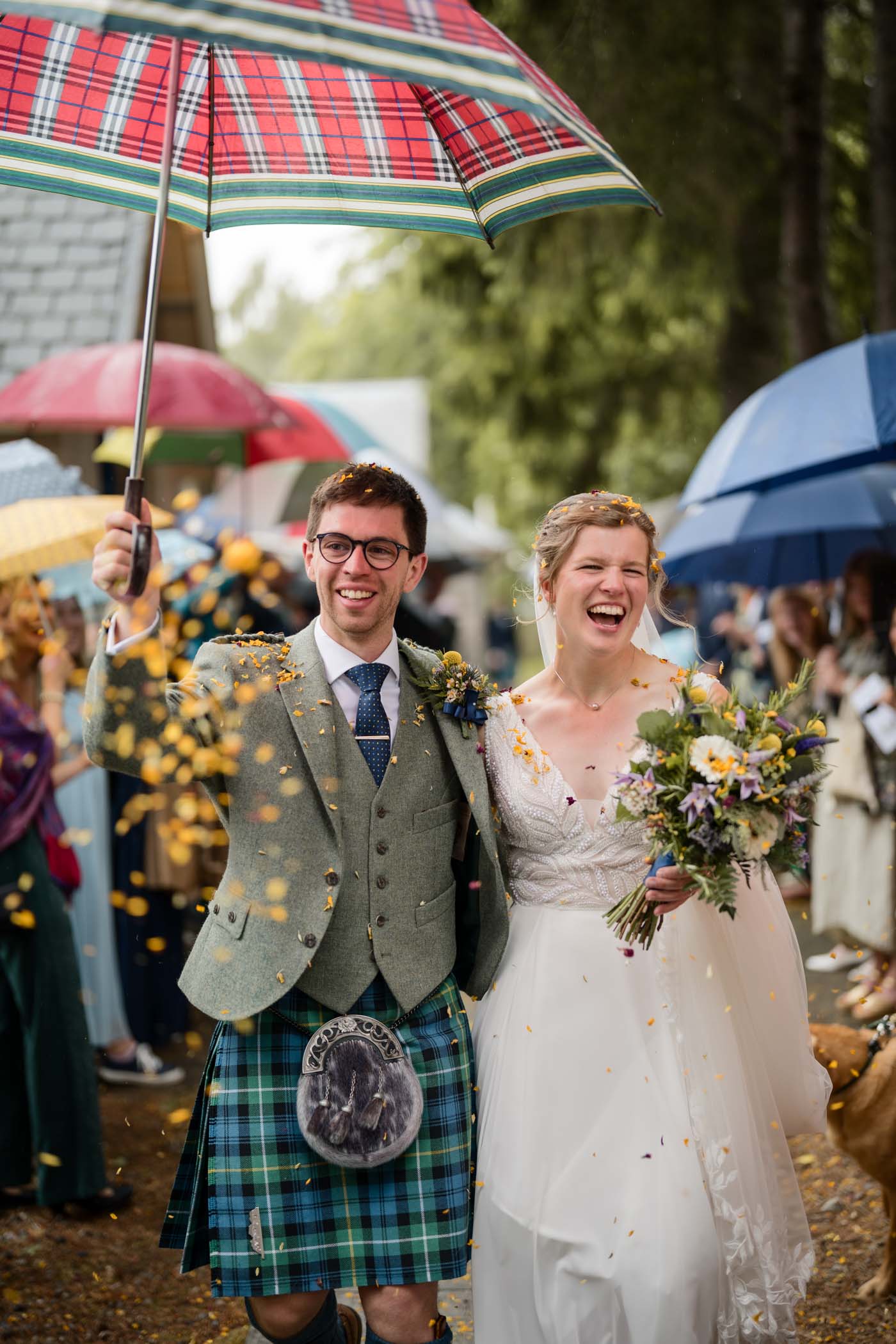 Newlyweds walking through a confetti shower
