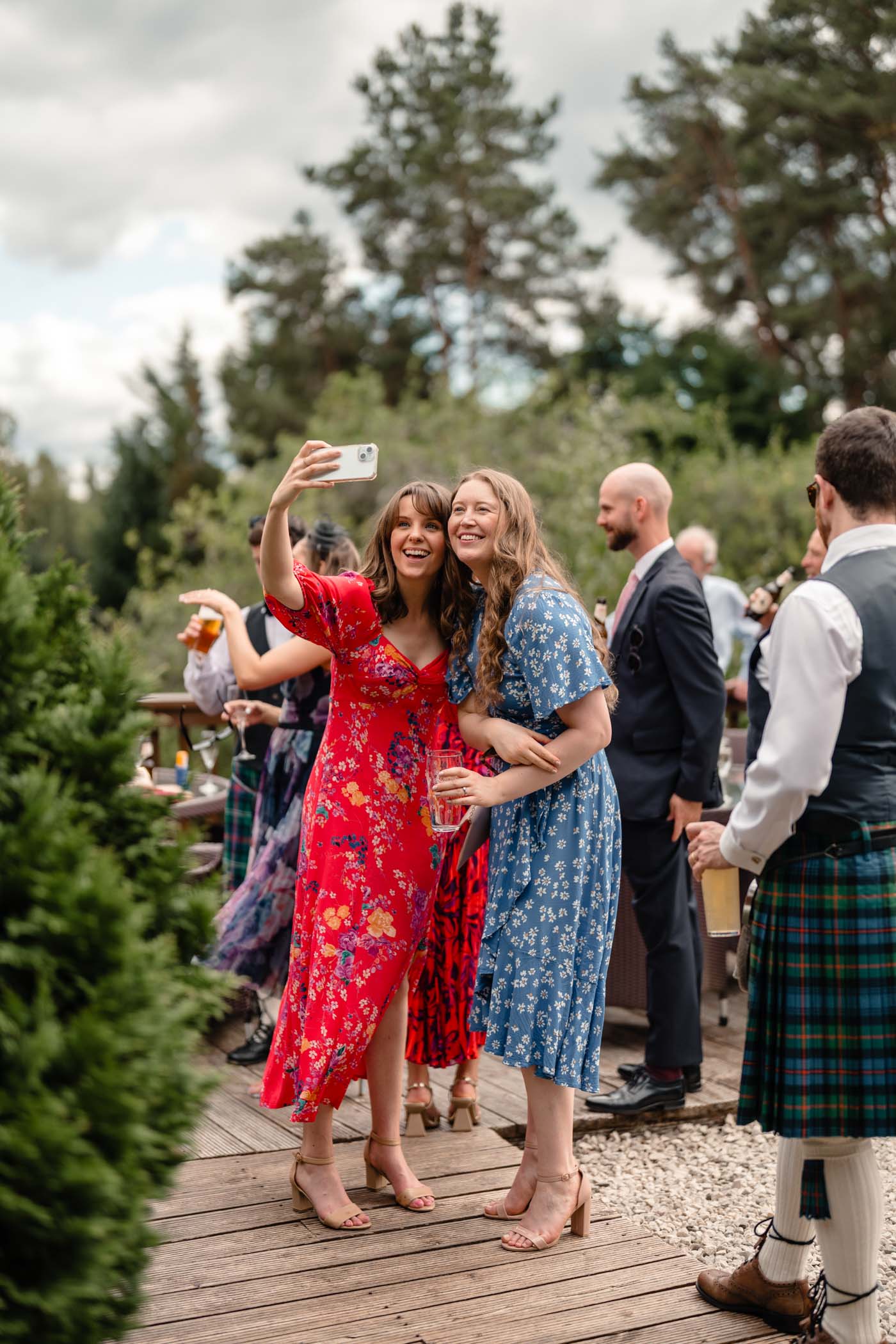Guests capturing a selfie while celebrating at the wedding