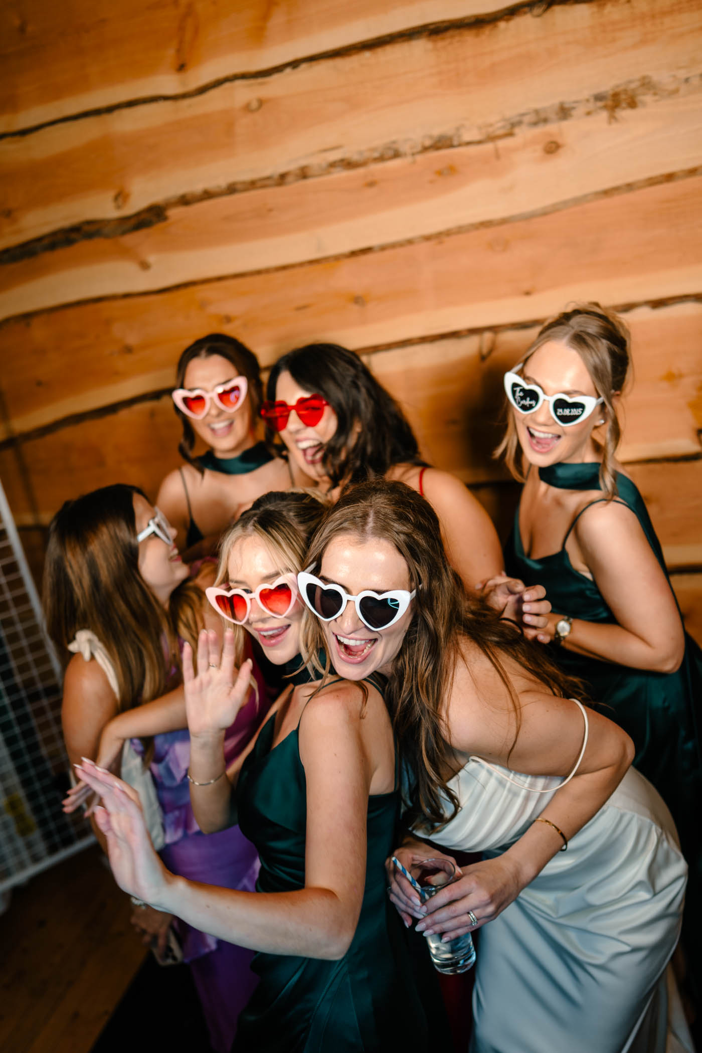 Bride and friends enjoying themselves in a photo booth